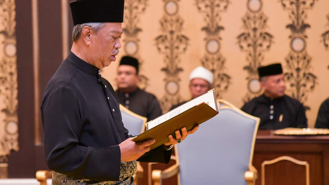 Muhyiddin Yassin reading the oath during his swearing-in ceremony.
