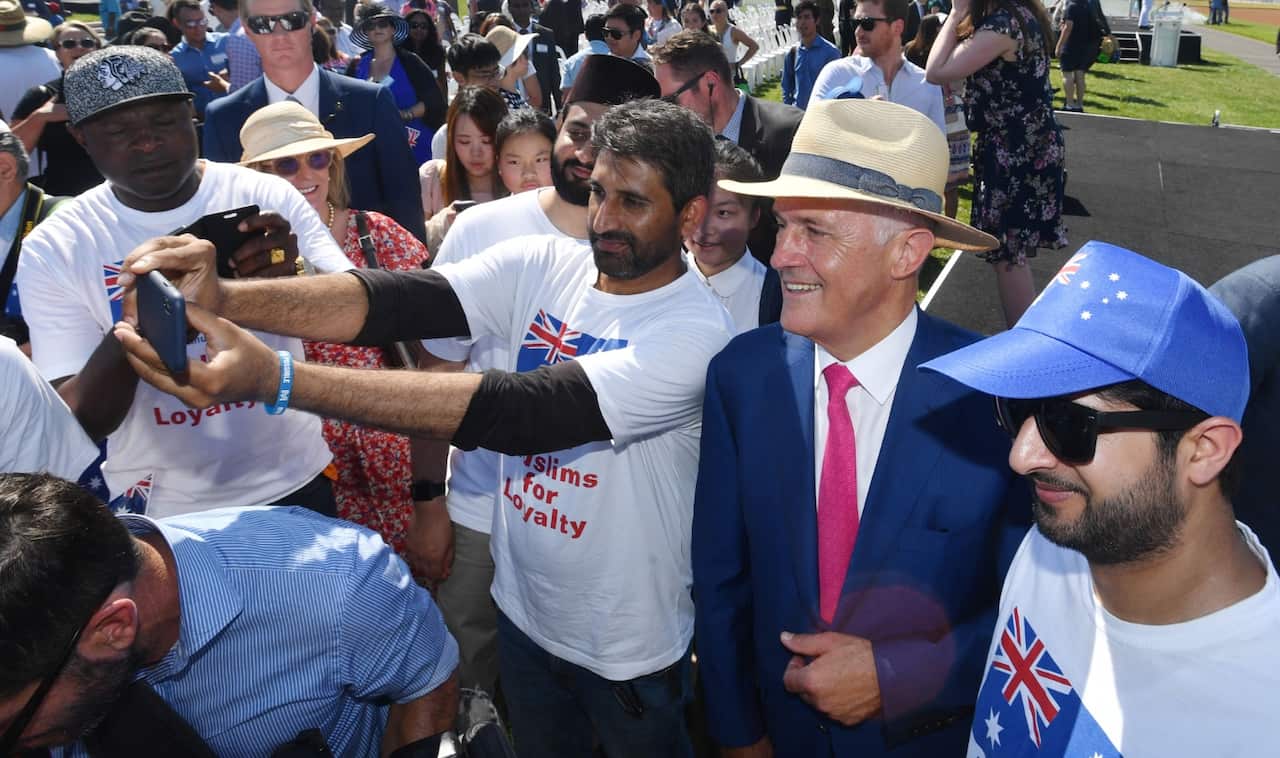 Prime Minister Malcolm Turnbull takes a selfie with members of the public after attending an Australia Day Citizenship Ceremony and Flag Raising event in Canberra, Friday, January 26, 2018. 