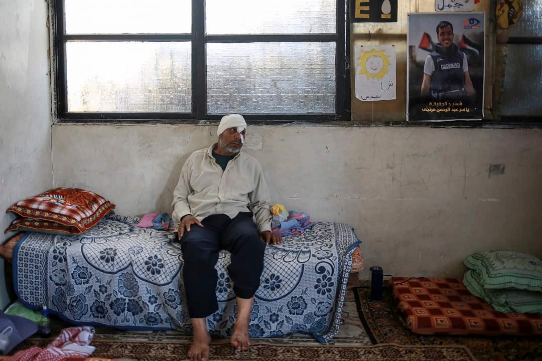 Mohammad Abu Mustafa, who was hit by a canister of tear gas at protests was aided by Rouzan al-Najjar on the day she was killed by a snipers bullet. 