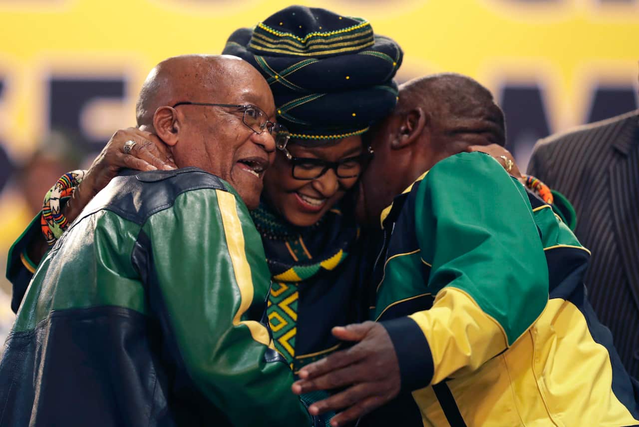 During December's ANC conference Winnie Mandela hugs Cyril Ramaphosa and then-President Jacob Zuma, left.