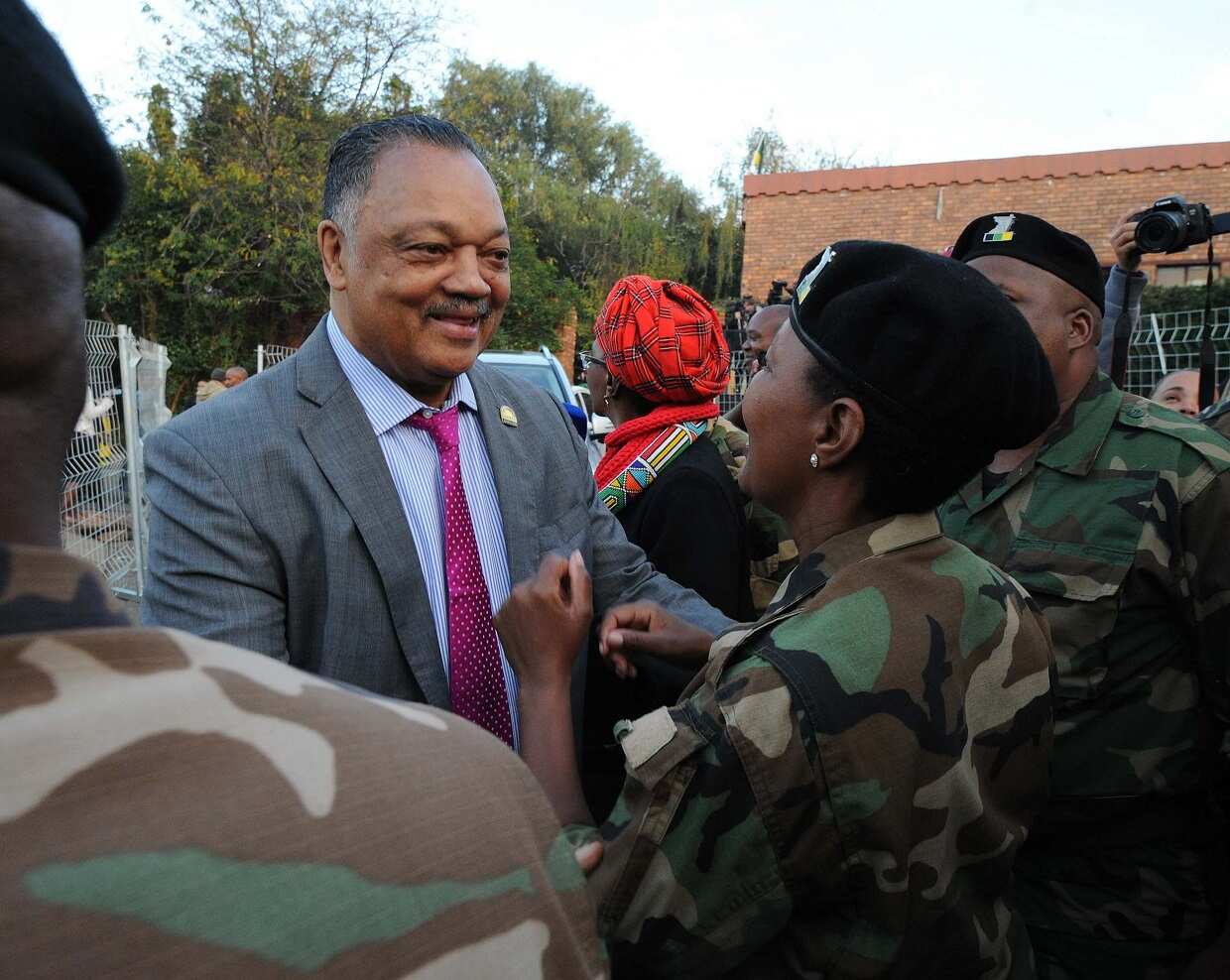 US civil rights activist Reverand Jesse Jackson and mourners at the Madikizela-Mandela home during the Family Valedictory service ahead of the funeral.