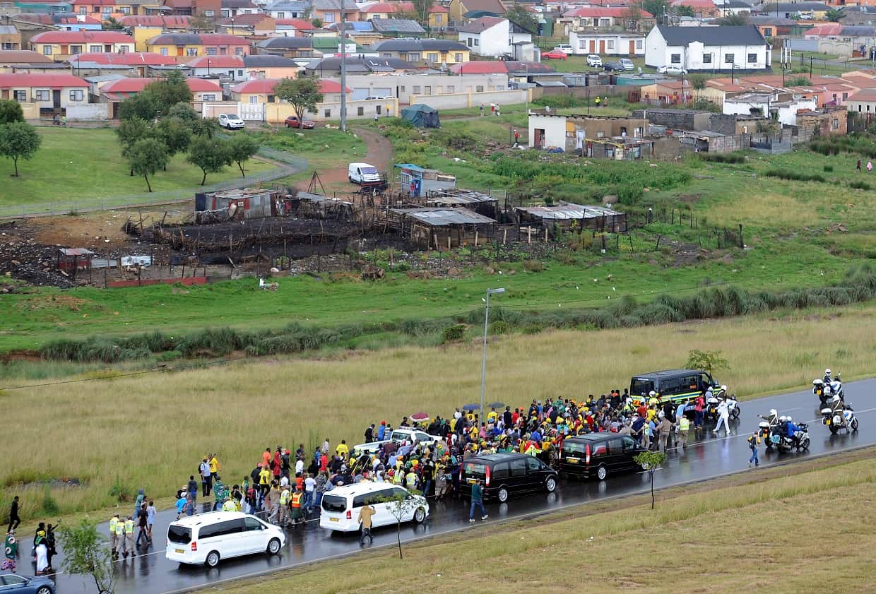 The funeral procession carrying the coffin of Winnie Madikizela-Mandela moves through Soweto after the official state funeral.
