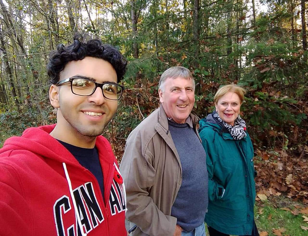 Iranian man Amir Taghinia with the Taylor family in Coquitlam, Canada. 