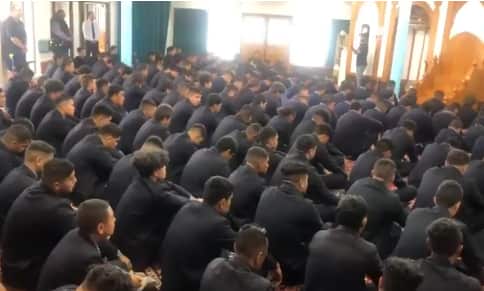 Auckland high school students sign a Maori hymn inside the Al-Masjid Al Jamie mosque. 