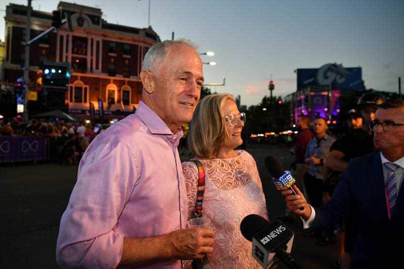Prime Minister Malcolm Turnbull and wife Lucy speaks to the media during the 40th annual Gay and Lesbian Mardi Gras parade in Sydney.