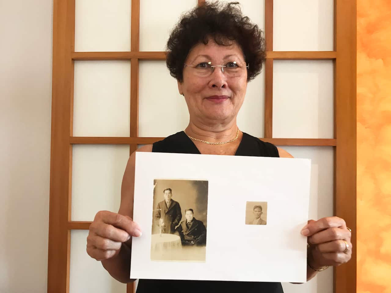 Marie-Jose Michel holds photos of her Japanese grandfathers.
