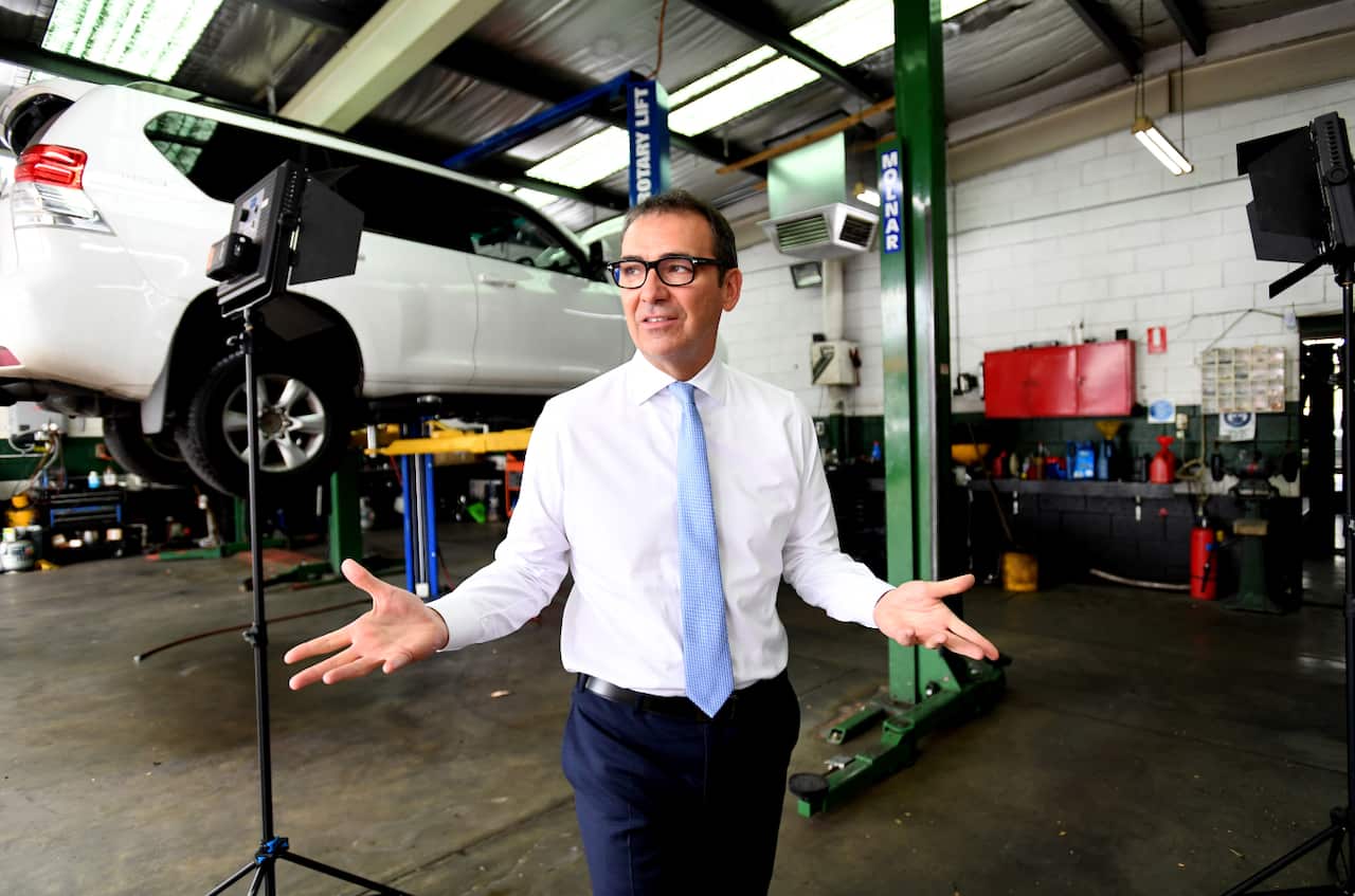 Liberal Leader Steven Marshall visited a mechanics on the final day of the campaign. 