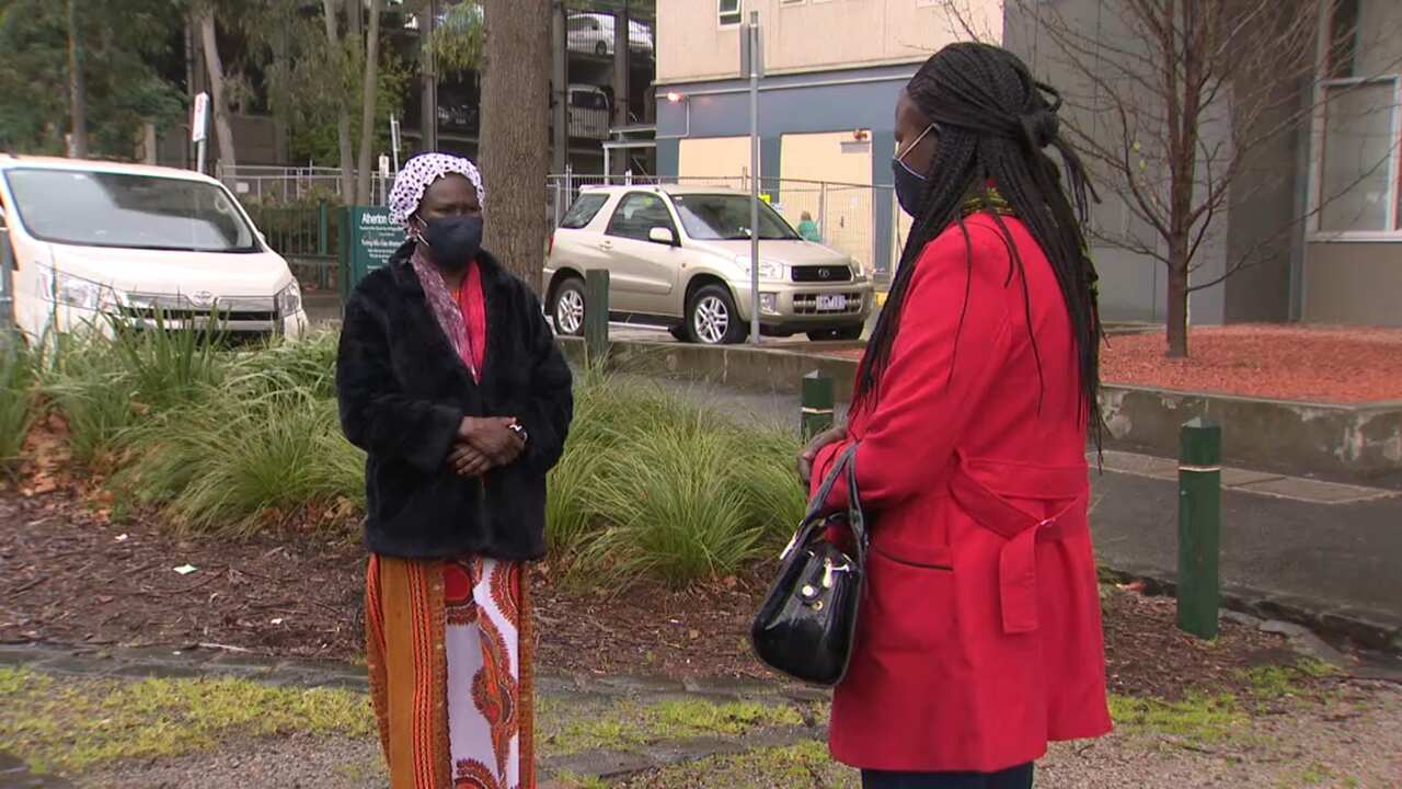 Mary Ajueth and Achol Aluier outside Atherton Gardens estate
