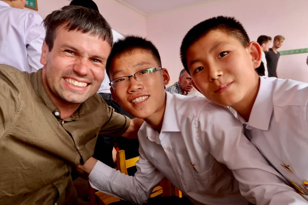               Tour guide Matt Kulesza with two North Korean students.                  