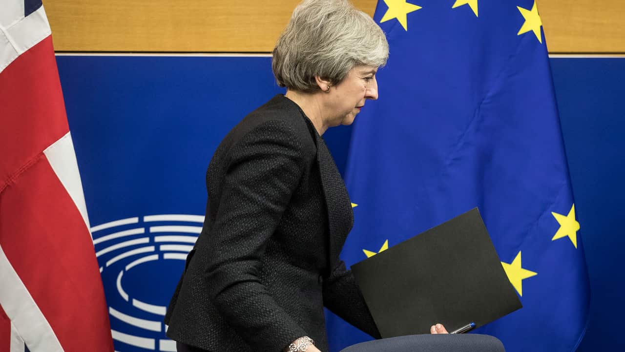 British Prime Minister Theresa May leaves after a media conference at the European Parliament in Strasbourg, eastern France. 