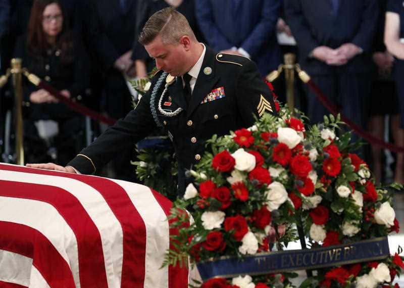 The senator's youngest son James "Jimmy" McCain, pays his respects.