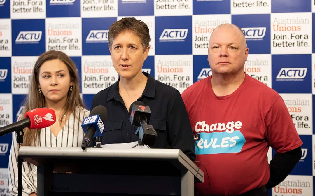 ACTU secretary Sally McManus (centre) with retail worker Stacey Vetehal and hospitality worker William Olson.
