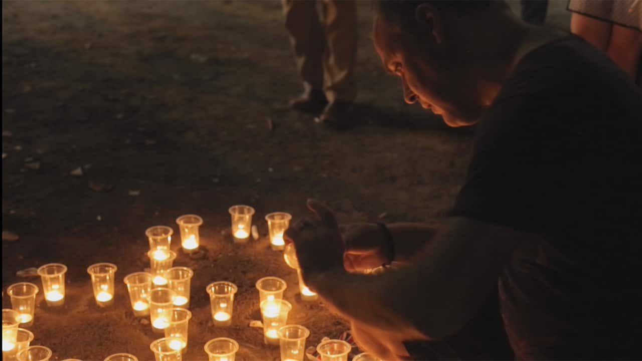 Jan lights candles on the anniversary every year in memory of those who died.