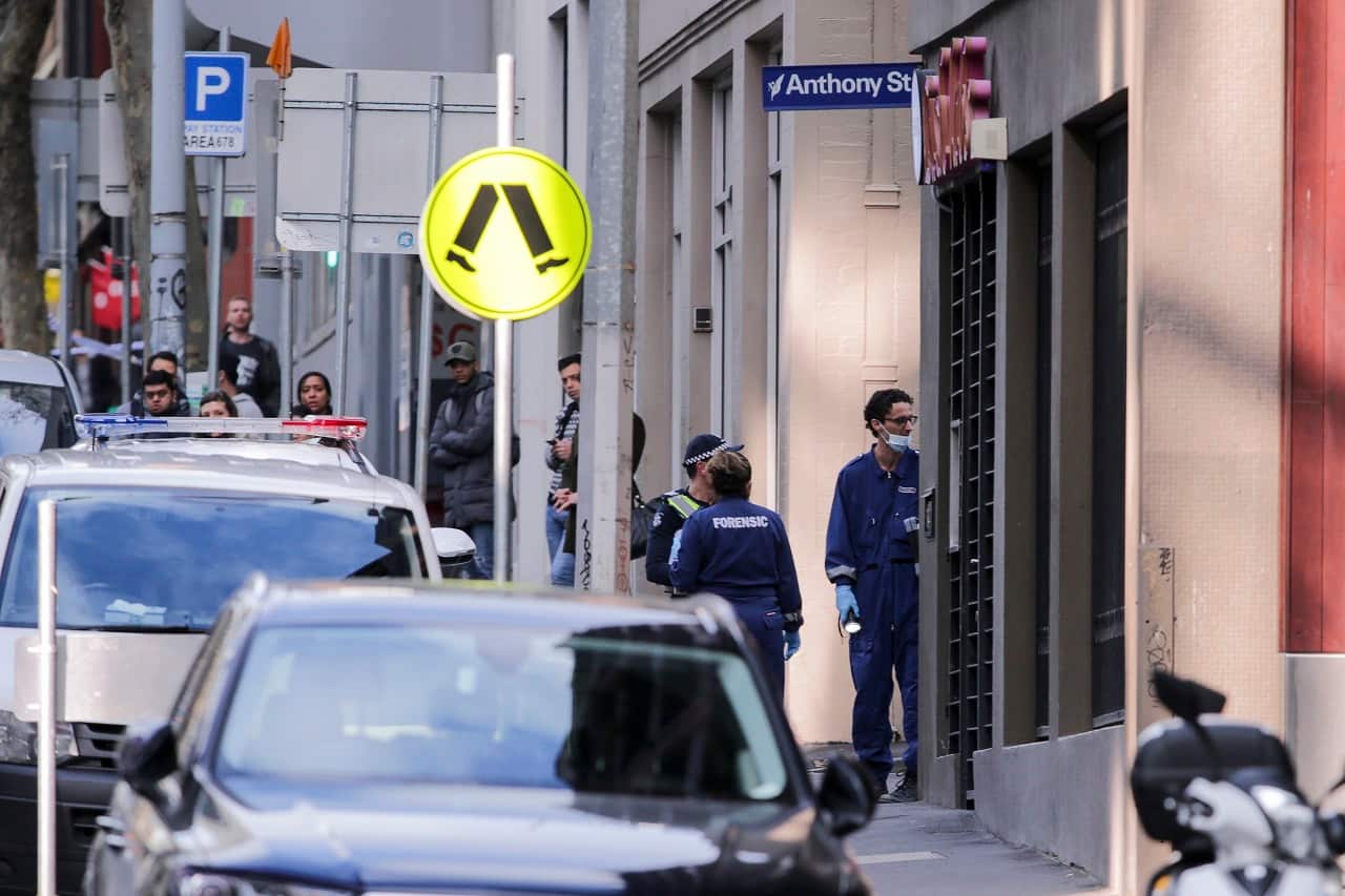 Police investigate a crime scene at the EQ Arcade building on A'Beckett Street in Melbourne, Saturday, July 21, 2018. A woman has died from injuries following an incident in a Melbourne CBD apartment. (AAP Image/Wayne Taylor) NO ARCHIVING