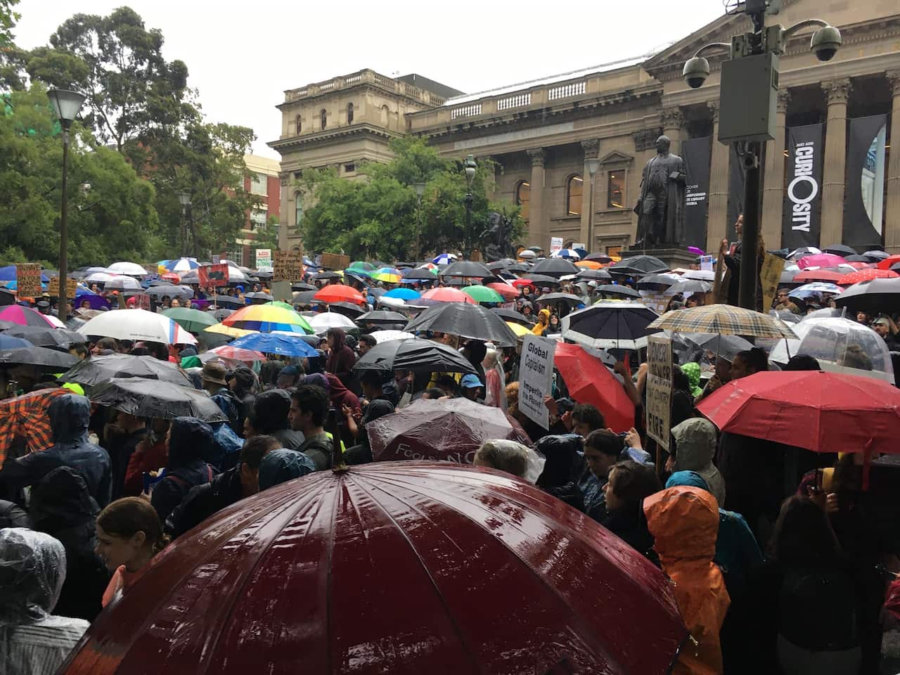 Wet conditions did not deter protesters in Melbourne. 