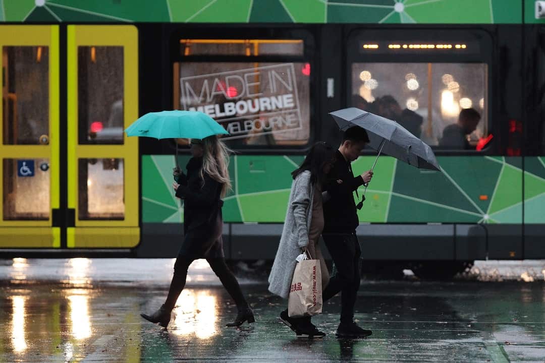 People use umbrellas in Melbourne. 