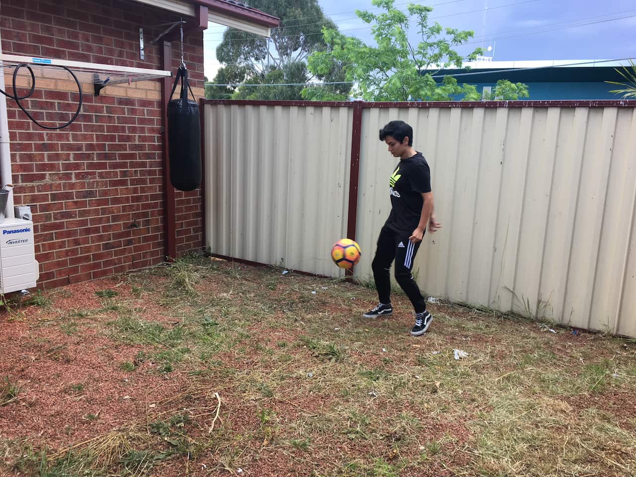 Melika playing football at home