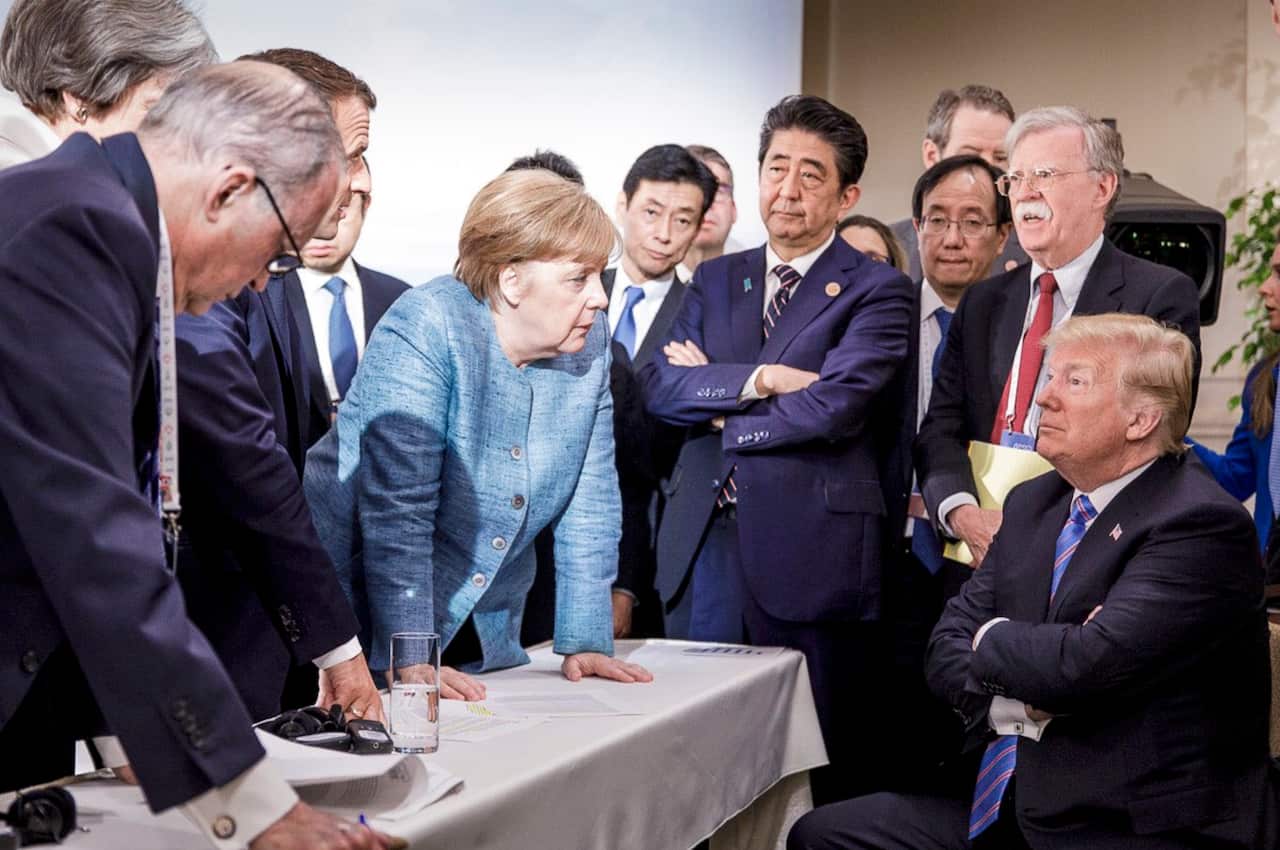 An iconic photo from the 2018 G7 meeting shows German Chancellor Angela Merkel staring down US President Donald Trump.