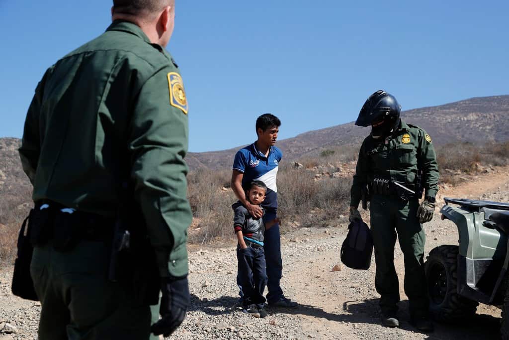 A father and son apprehended at the U.S Border. 