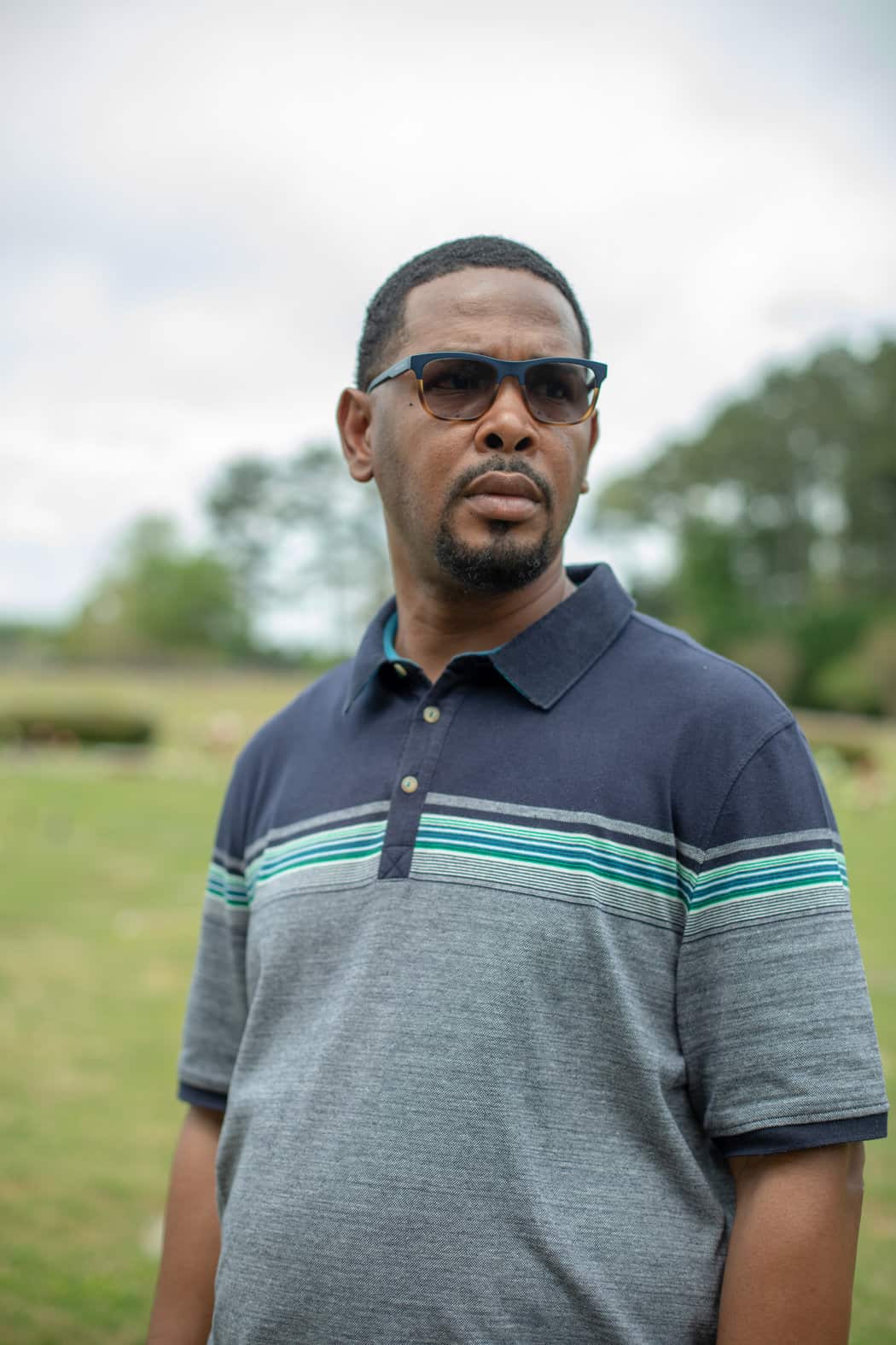 Anthony Terrell visiting the gravesite of his brother, Earl Terrell.