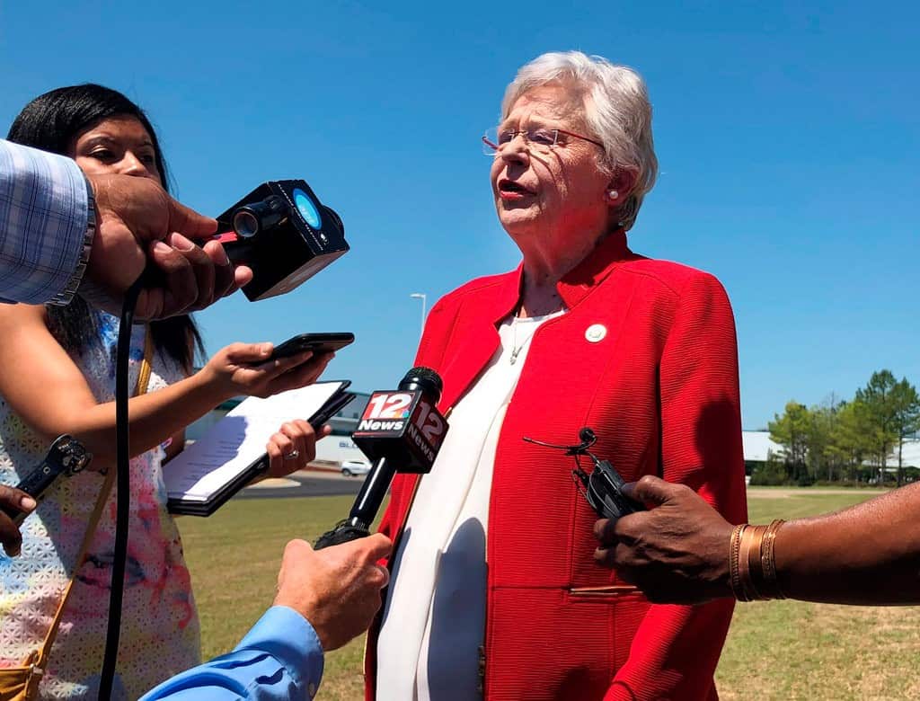 Gov. Kay Ivey said she would allow the scheduled execution of a convicted murderer to go ahead, a day after she signed into law a near-total ban on abortions.