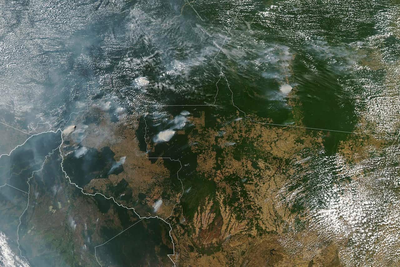A satellite image showing fires burning in the Brazilian states of Amazonas, upper left, Para upper right, Mato Grosso, lower right, and Rondonia, lower left.