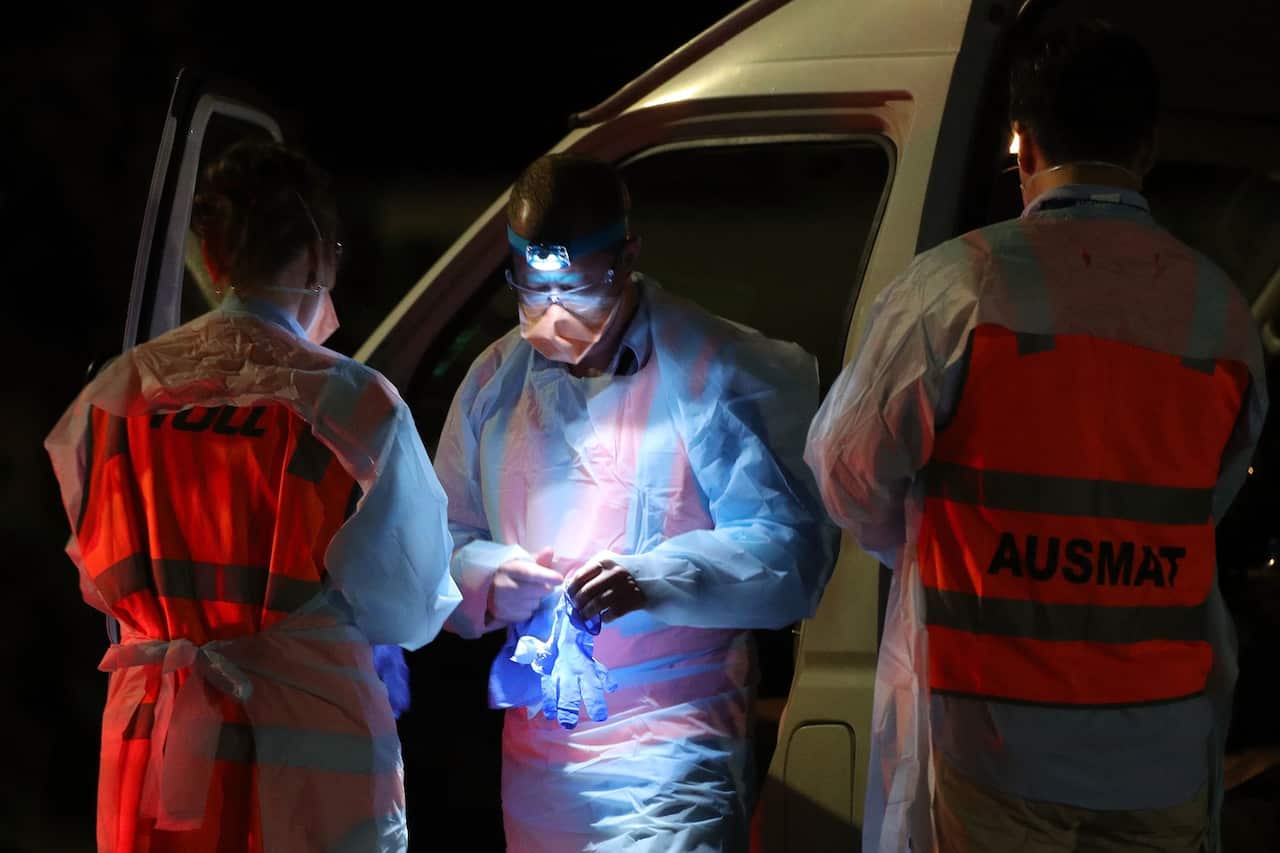 Medical personnel preparing for the arrival of evacuees on Thursday.Credit...