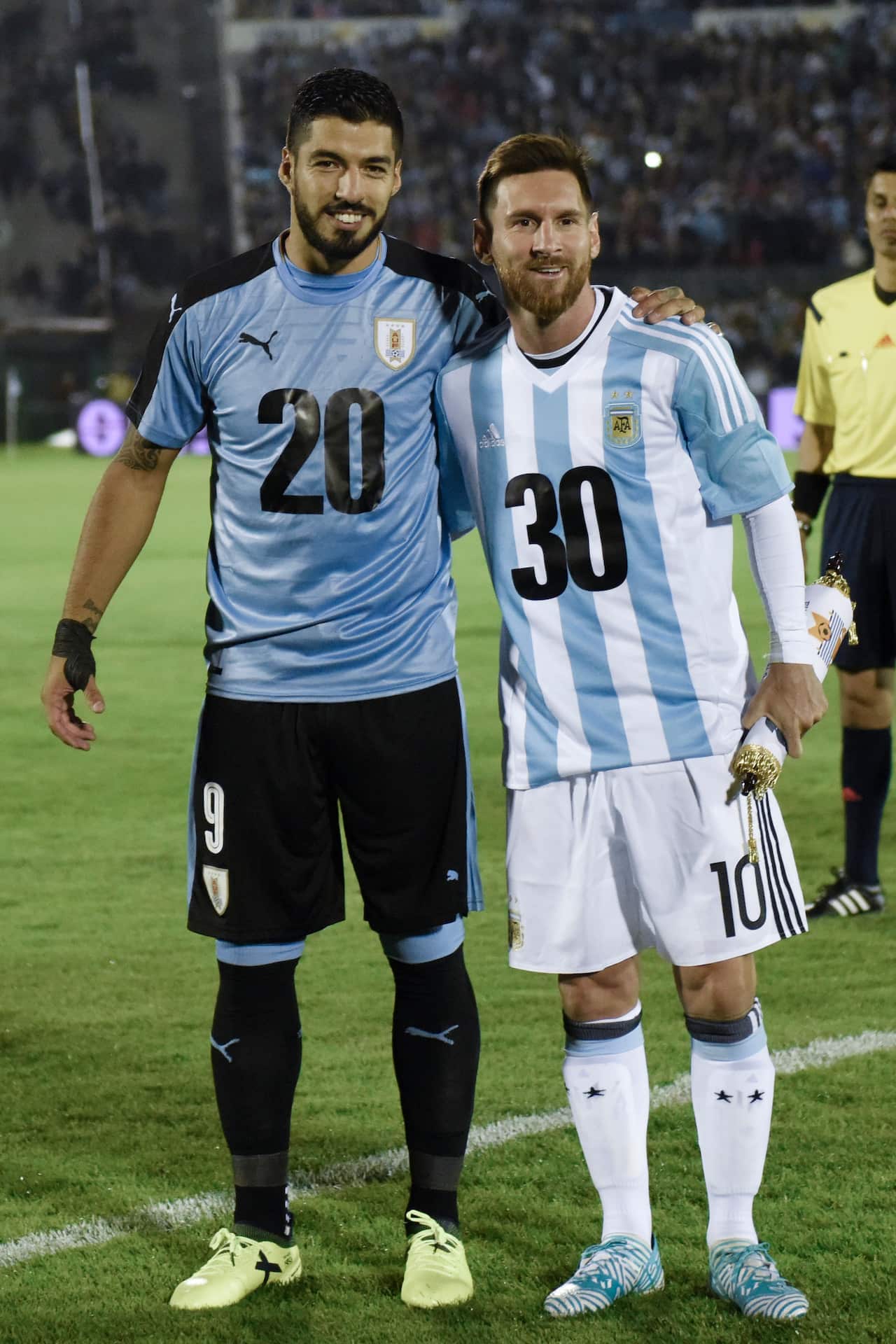 Uruguay’s Luis Suarez [L] and Lionel Messi of Argentina backing the bid to have the nations' co-host the 2030 World Cup.  Montevideo, Uruguay, Thursday, Aug. 31, 2017. (AP Photo/Matilde Campodonico)