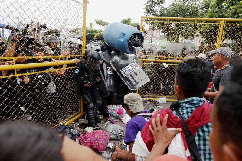 The caravan of migrants clash with the Guatemalan Police, in Tecun Uman, Guatemala.