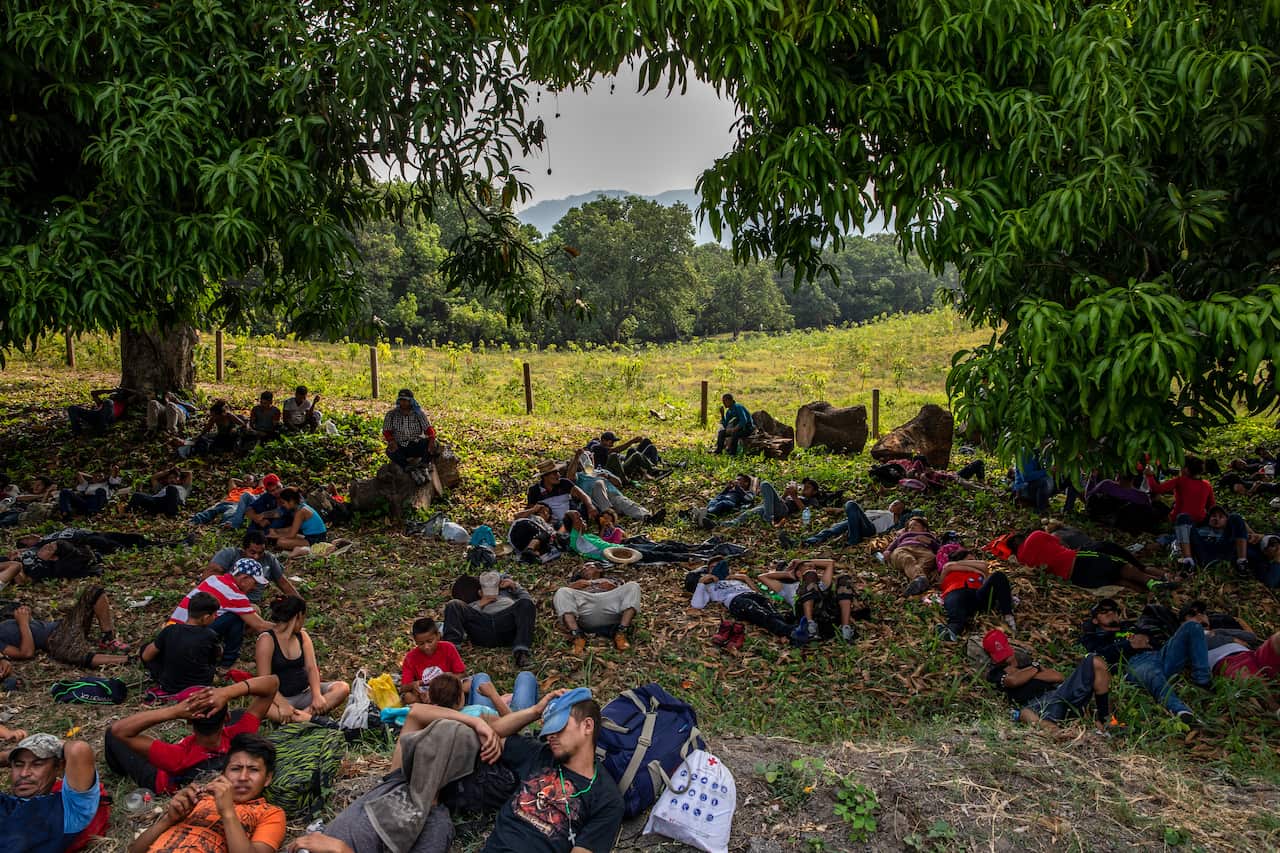 Migrants rest while they make their way through the Mexican state of Chiapas, Mexico, near the town of Huixtla.