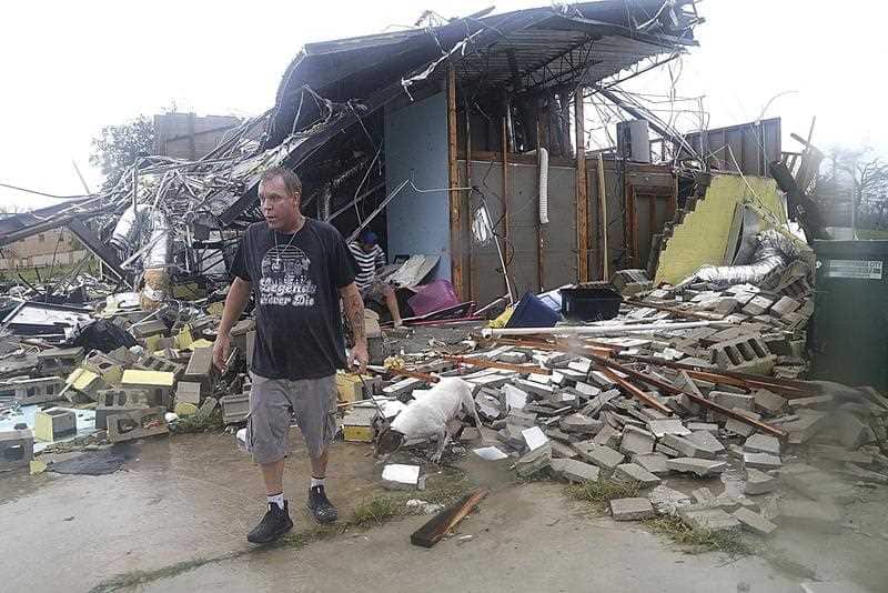 Brian Bon inspects damages in the Panama City downtown area after Hurricane Michael made landfall in Panama City, Florida.