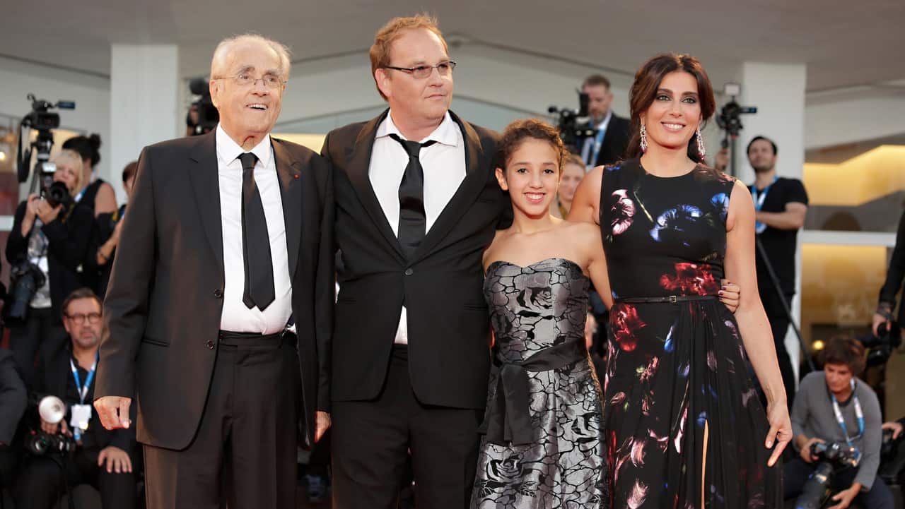 From left, conductor Michel Legrand, director Xavier Beauvois, actors Seli Gmach and Nadine Labaki during the 71st edition of the Venice Film Festival in 2014.
