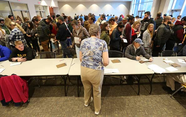 A crowd of people wait in line at a polling center  in Utah.