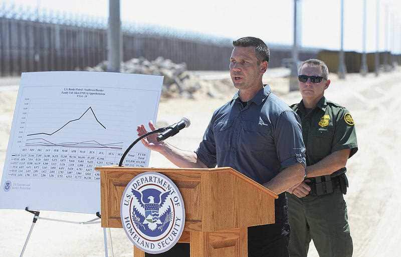 Acting Secretary of Homeland Security Kevin McAleenan, left, speaks to the media on the U.S.-Mexico border.