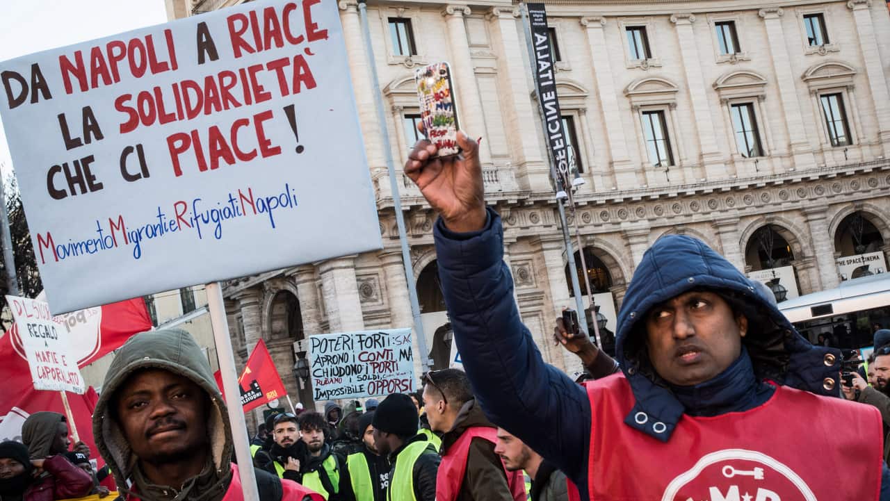 People demonstrate in Rome against racism and the government's immigration policies.