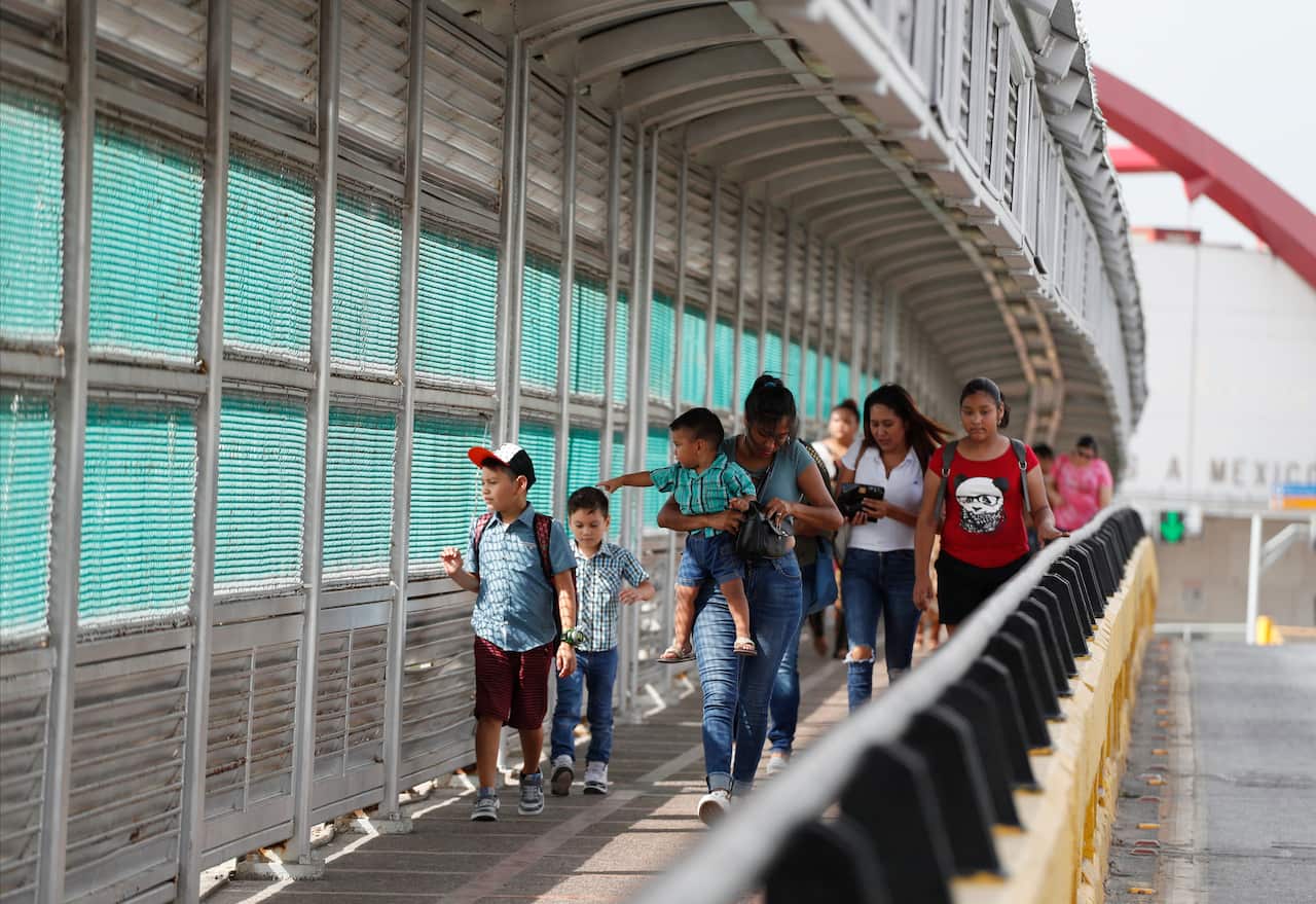 The Puerta Mexico bridge leading into the US. A judge has put on hold a Trump administration rule requiring immigrants prove they will have health insurance.