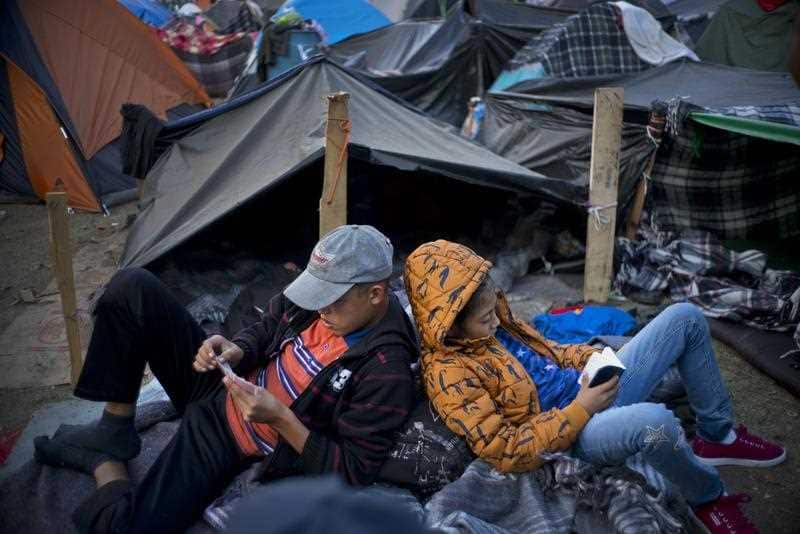 The migrant caravan rest at a sports complex where more than 5,000 Central American migrants are sheltering in Tijuana, Mexico.