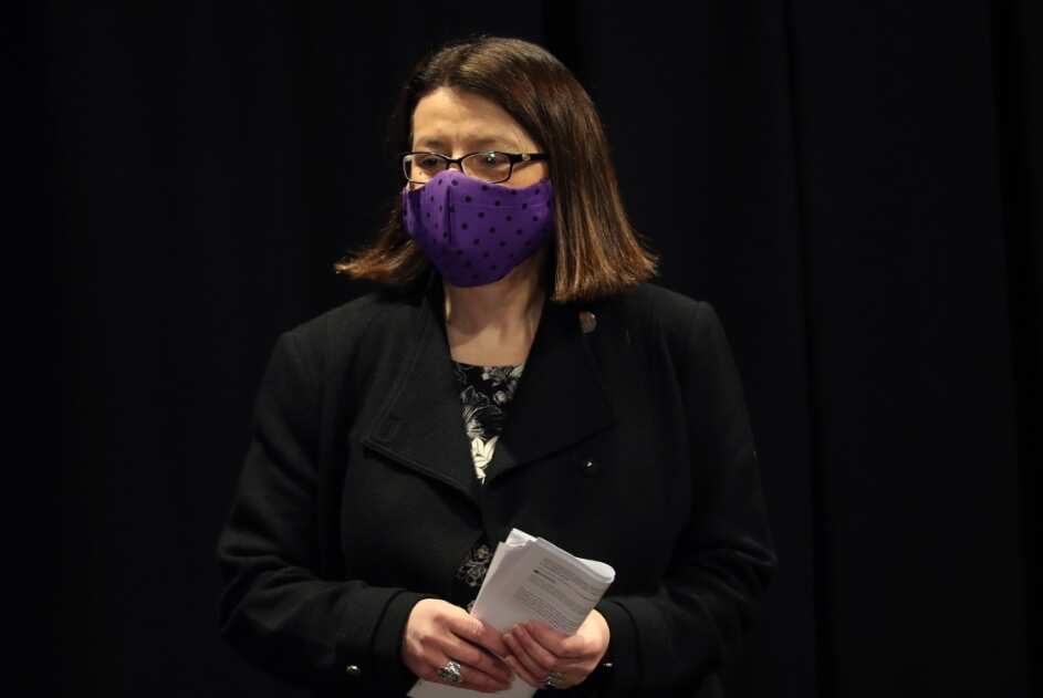Health Minister Jenny Mikakos waits to speaks to the media during a press conference in Melbourne