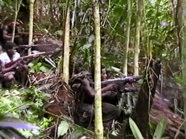 Armed Bougainvilleans in the jungles of their Pacific island.