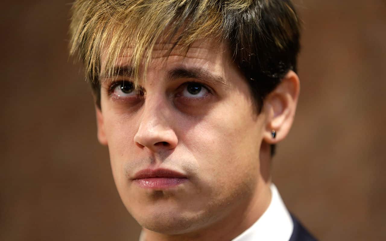 Milo Yiannopoulos listens during a news conference in New York earlier this year. 