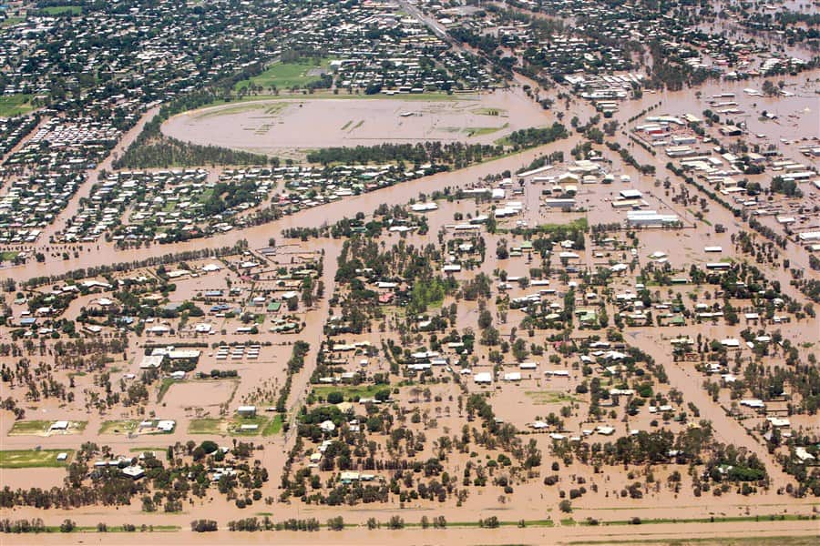 A photo from a helicopter of a town underwater.