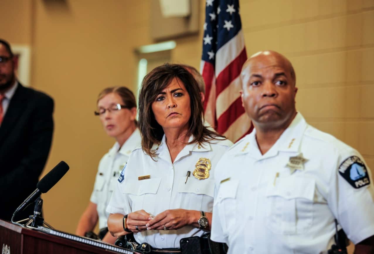 Minneapolis police chief Janee Harteau, center, stands with police inspector Kathy Waite, left, and assistant chief Medaria Arradondo during a news conference 