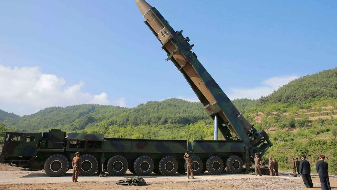North Korean leader Kim Jong Un, second from right, inspects the preparation of the launch of a Hwasong-14 ICBM in this 2017 file photo.