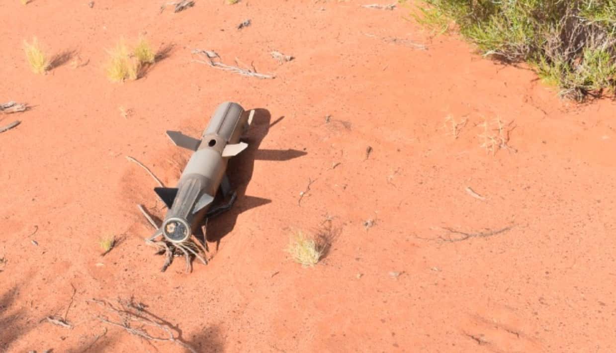 The high-tech anti-aircraft missile on the ground in the desert.