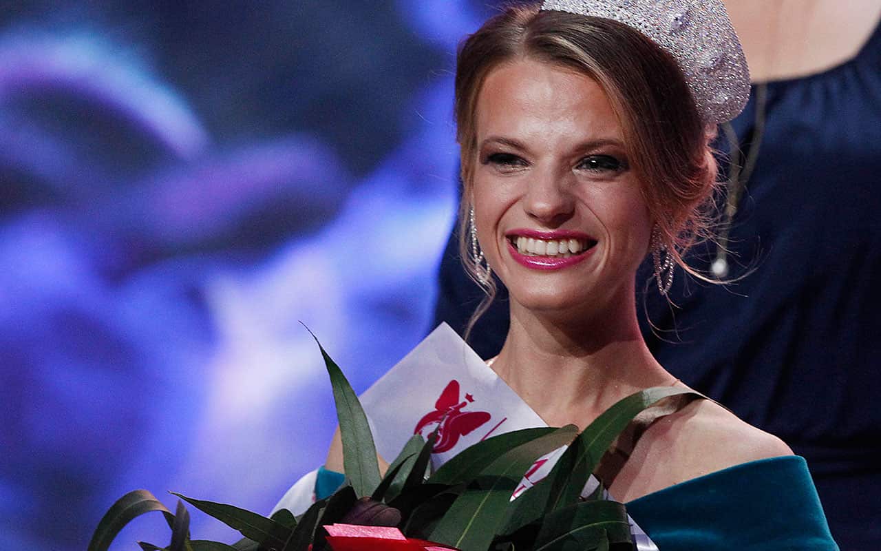 Miss Belarus Aleksandra Chichikova greets the audience after she was crowned Miss Wheelchair World.