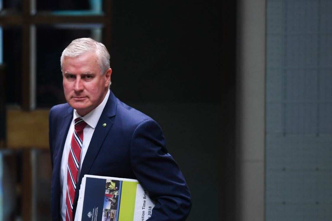 Australian Deputy Prime Minister Michael McCormack reacts during House of Representatives Question Time at Parliament House in Canberra.