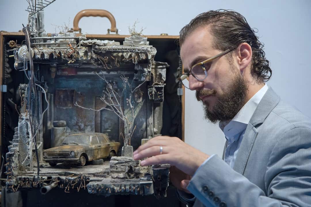 Artist Mohamad Hafez with his model.