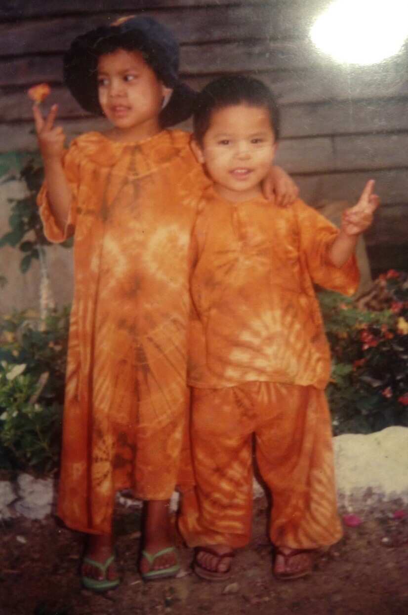 Monica with her younger brother in Myanmar.