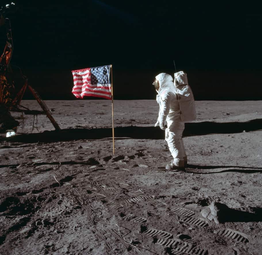 In this July 20, 1969 photo made available by NASA, astronaut Buzz Aldrin Jr. poses for a photograph beside the U.S. flag on the moon during the Apollo 11 mission.
