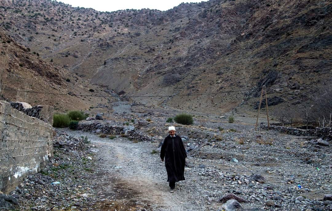 A man walks near the tourist village of Imlil in the High Atlas range where the bodies of two tourists were found.